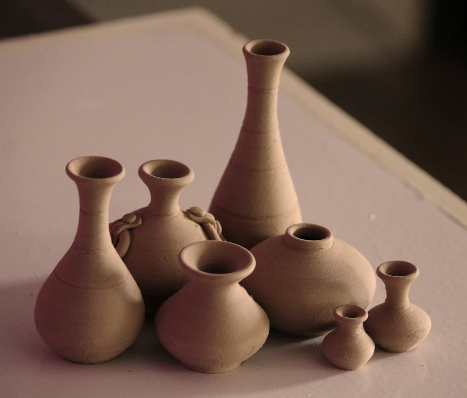 Unglazed clay vases of different shapes