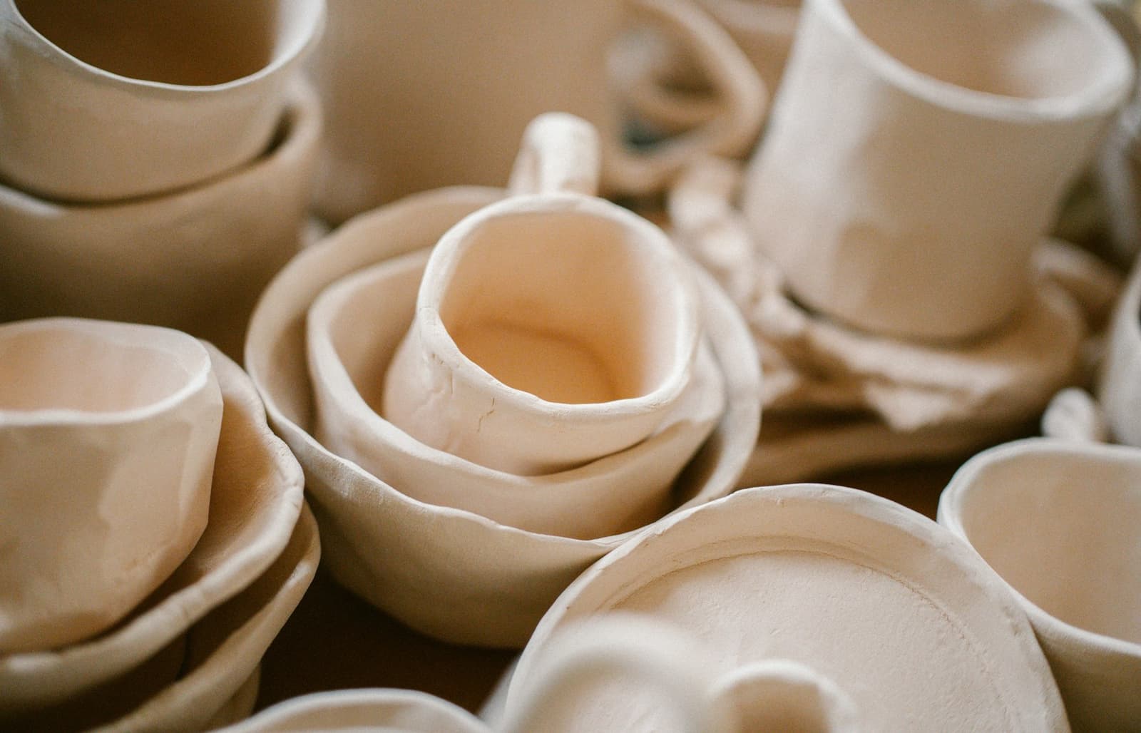 Unfired clay cups and bowls
