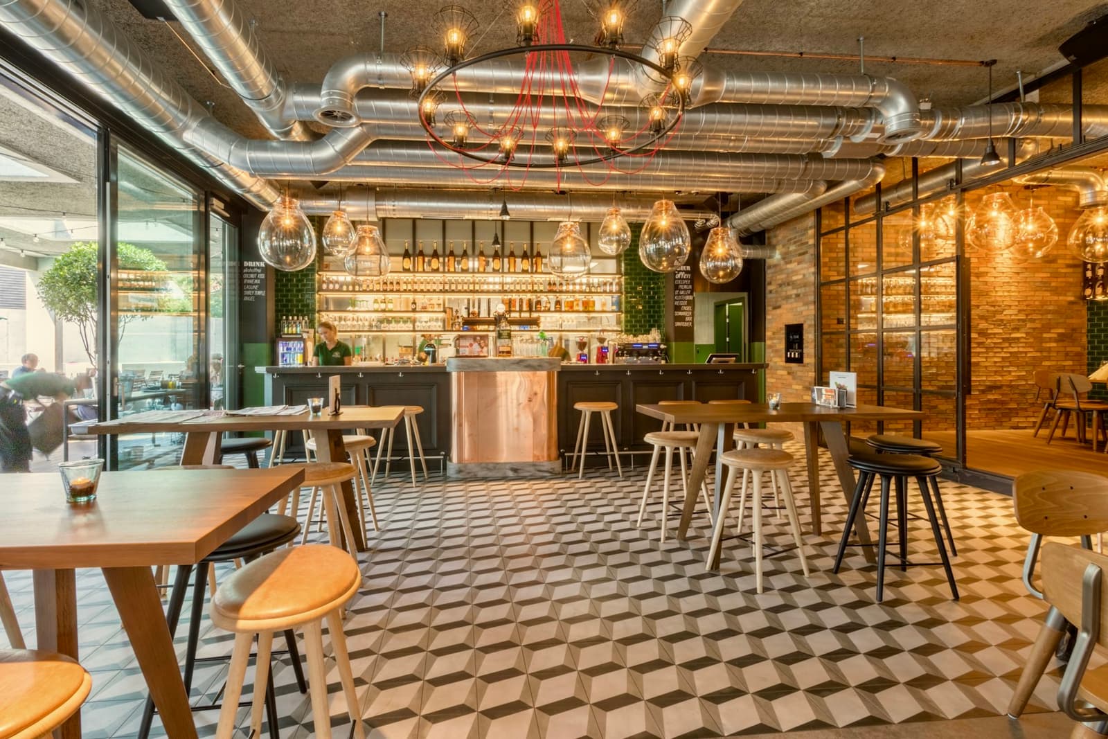 Tables and chairs inside a warmly lit café