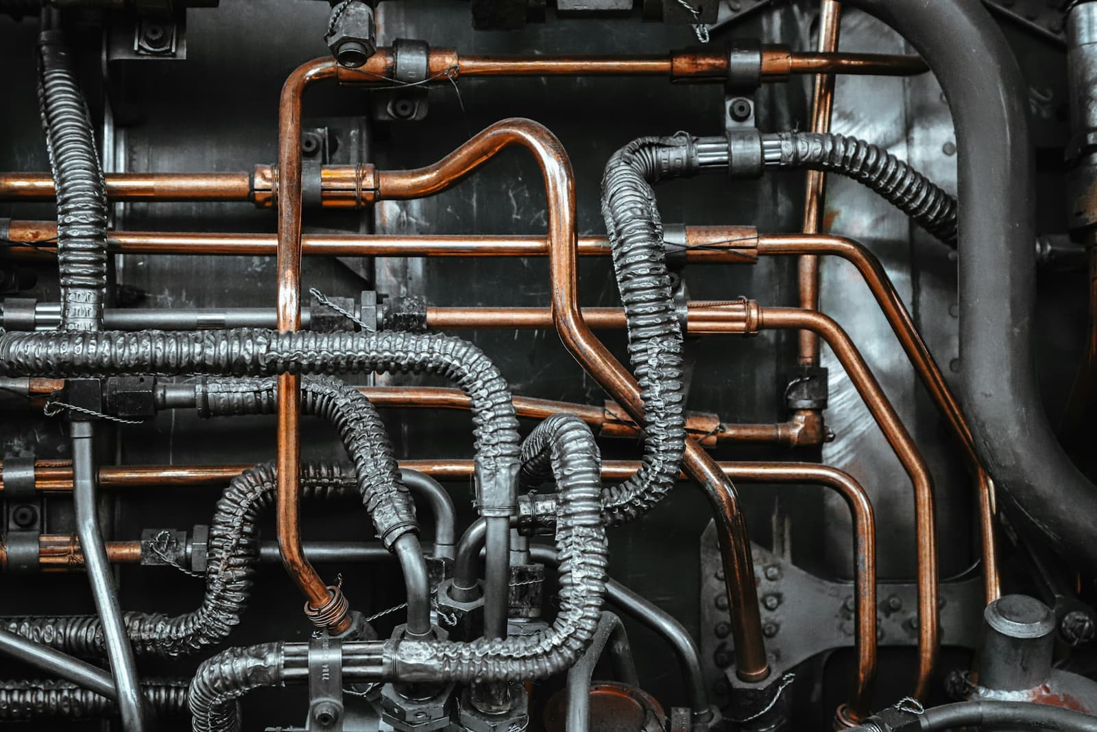 Copper pipes neatly fitted on a wall